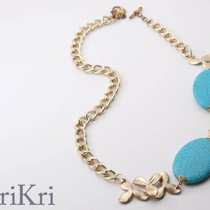 Statement golden necklace with turquoises. Flower necklace