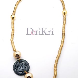 Dragon necklace with green jade pendant and earrings.