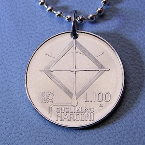 May include: Silver coin pendant with a chain. The coin features a design of a radio antenna with the text "1874 1974 L.100 R GUGLIELMO MARCONI"