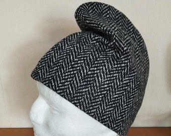 Phrygian cap made of white, black and grey herringbone wool fabric.