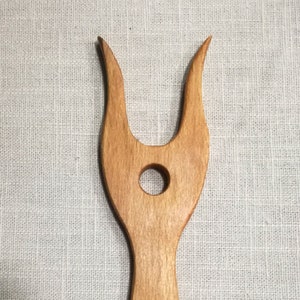 Lucet made of wood.