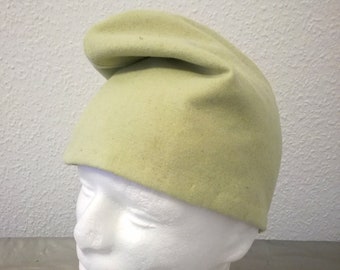 Phrygian cap made of soft green wool fabric.