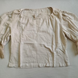 Women&#39;s shirt made of white cotton fabric for historical re-enactment.
