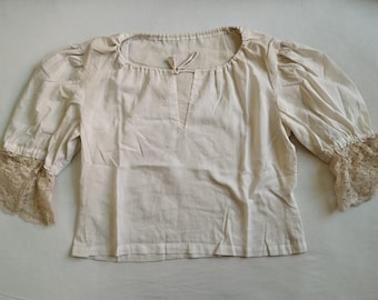 Women's shirt made of white cotton fabric for historical re-enactment.