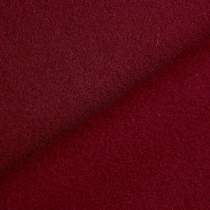 Tissu en laine 100% naturelle de couleur bordeaux.