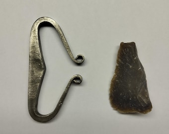 Hand-forged link and flint.