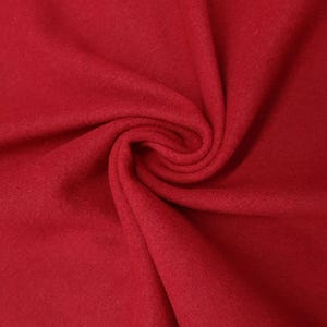 Tissu 100% laine naturelle de couleur rouge.