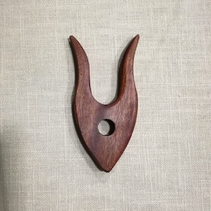Lucet made of wood.