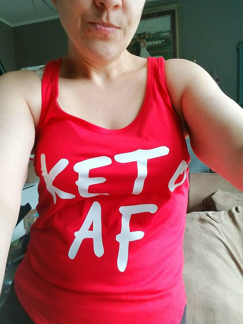 May include: Red tank top with the text "Keto AF" written in white.