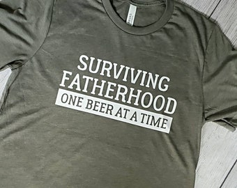 Surviving Fatherhood one beer at a time, funny dad shirt, dad beer shirt