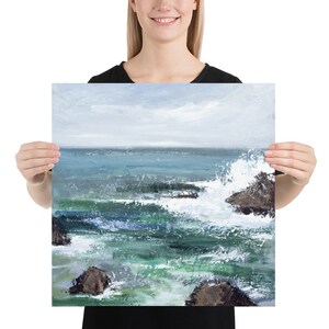 May include: A painting of a seascape with crashing waves and rocky outcroppings. The water is a vibrant blue-green, and the sky is a soft gray. The painting has a calming and peaceful feel.