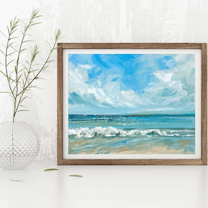 May include: A framed painting of a seascape with blue water, white waves, and a light blue sky with white clouds.
