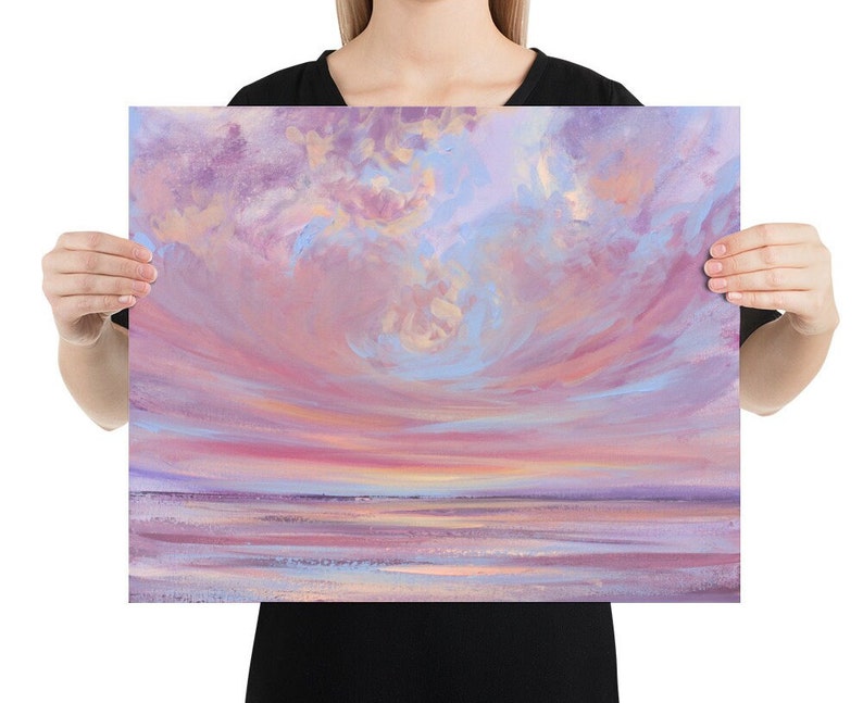 May include: A painting of a pink and purple sunset over a calm body of water. The sky is filled with fluffy clouds, and the water is a soft blue.