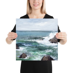 May include: A painting of a seascape with crashing waves and rocky outcroppings. The water is a vibrant blue-green, and the sky is a soft gray. The painting is done in a loose, impressionistic style.