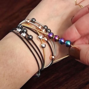 Snap stretch picking discipline bracelet Discreet anxiety help fidget armband Stim jewelry for working adults Acupressure  rolling beads