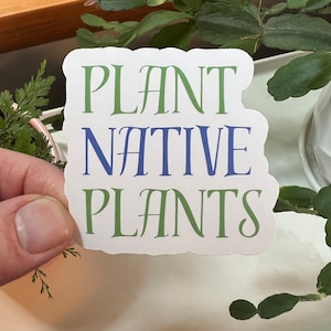 May include: White sticker with the text "PLANT NATIVE PLANTS" in green and blue lettering.