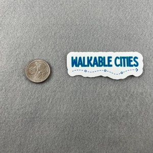 May include: A white sticker with a blue outline and the text "WALKABLE CITIES" in blue letters. A dashed line with three circles follows the text, ending with an arrow.