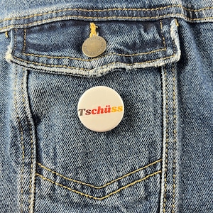 Tschüss German Language 1.25&quot; Button Pin Badge Pinback Button | German American Goodbye German Flag Germany Typography Europe