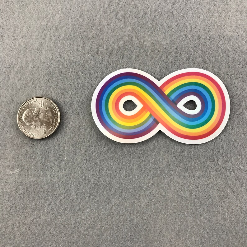 May include: A rainbow infinity symbol sticker. The sticker is white with a rainbow colored infinity symbol. The sticker is about the size of a US quarter.