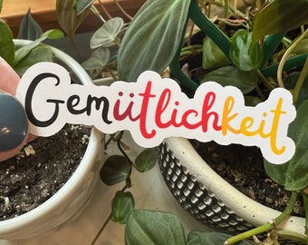 Gemütlichkeit German Die Cut Typography Sticker | Matte Vinyl Friendly Good Cheer Warmth German Flag Germany Sticker | German Words Language