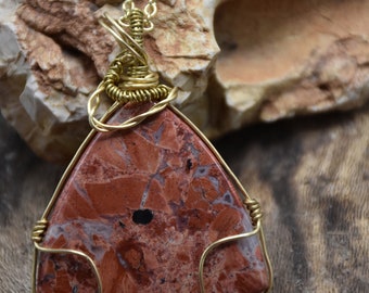 Flame Jasper Stone wire wrapped with brass wire. The chain gold plated.