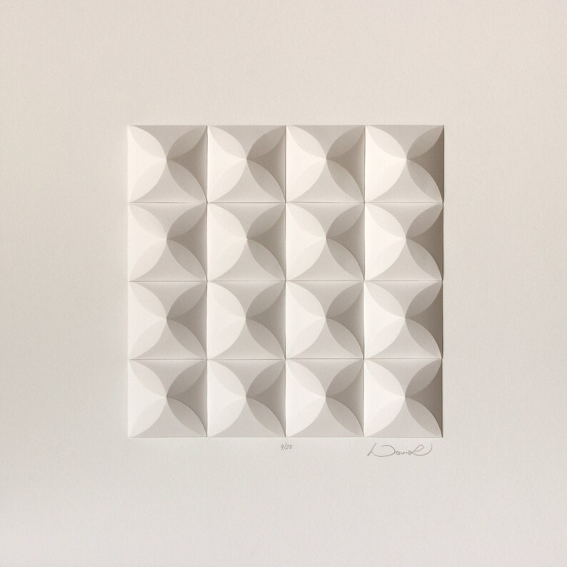 May include: White paper sculpture with a geometric pattern of overlapping circles. The sculpture is signed "David" in the bottom right corner and "607" in the bottom left corner.