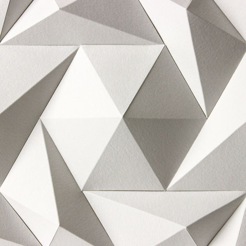 May include: Abstract geometric pattern with a white and gray color scheme. The pattern is made up of triangles that are folded to create a three-dimensional effect.