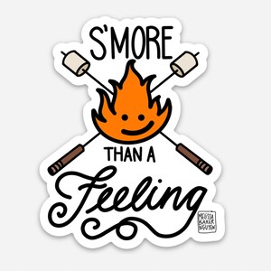May include: A white sticker with a black outline features a campfire with a smiling face, two crossed sticks with marshmallows, and the text "S'more than a feeling". The text "Melissa Baker Nguyen" is in the bottom right corner.
