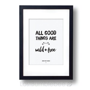 May include: Black and white framed print with the text "All good things are wild + free".