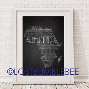 May include: A black and white chalkboard print with a stylized map of Africa. The map is outlined with a decorative pattern and the word "AFRICA" is written in bold letters across the continent.