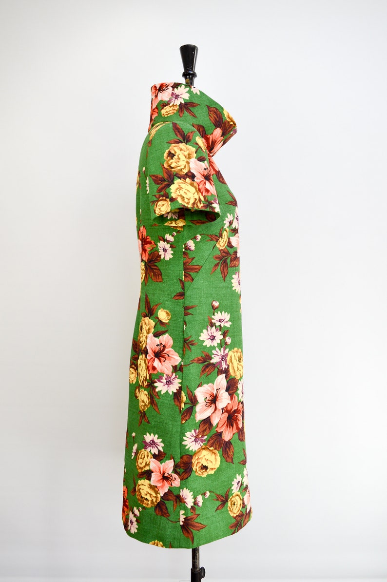 Stunning side view of the French Dart Shift Dress sewing pattern, showcasing its elegant design and short sleeve version in green vintage floral barkcloth fabric