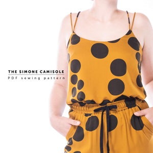 May include: A PDF sewing pattern for a sleeveless top called "The Simone Camisole". The top is mustard yellow with large black polka dots.
