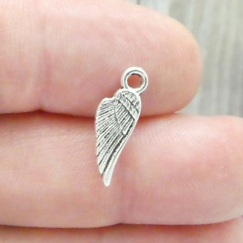 BULK 60 Silver Angel Wing Charm 18x6mm by TIJC SP0868B Etsy