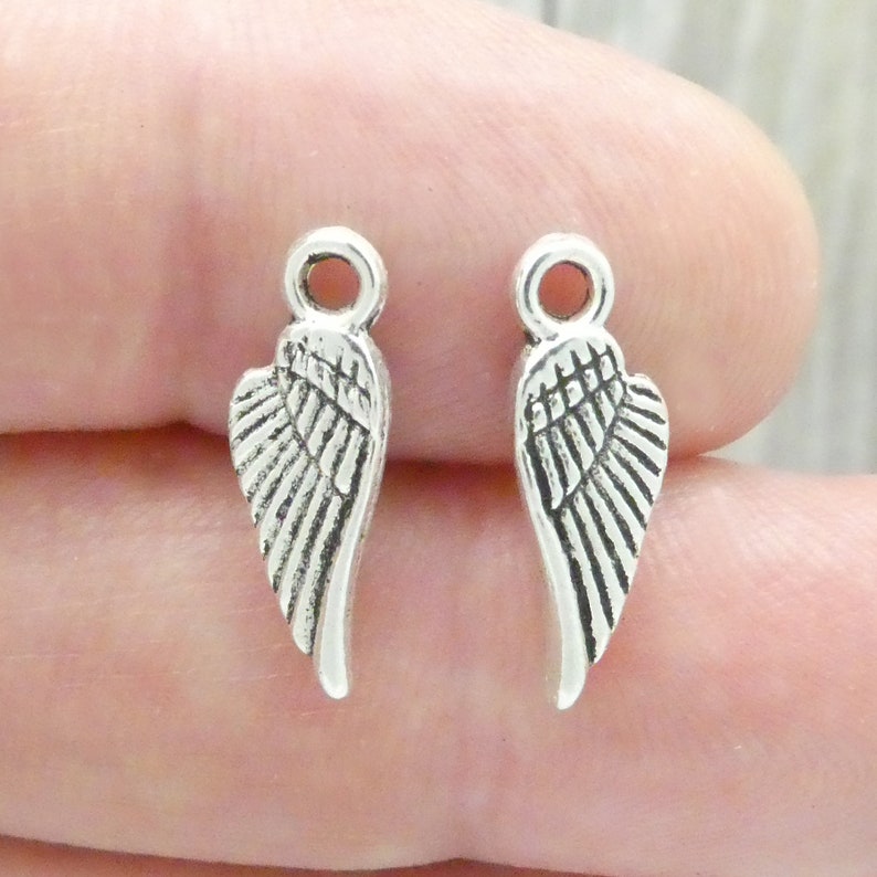 BULK 60 Silver Angel Wing Charm 18x6mm by TIJC SP0868B Etsy