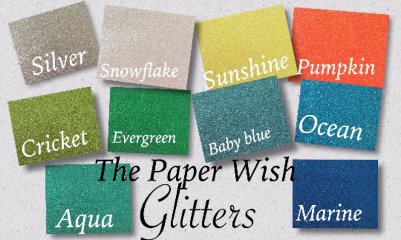 May include: A collection of glitter samples in various colours, including silver, snowflake, sunshine, pumpkin, cricket, evergreen, baby blue, ocean, aqua, and marine. The text "The Paper Wish Glitters" is displayed below the samples.
