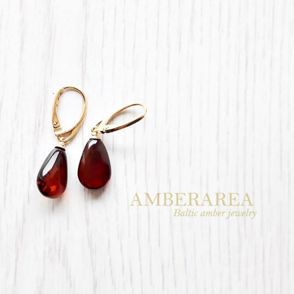 Baltic amber earrings with gold plated silver. Natural cherry amber color. Drop shaped earrings for women. 0302/1