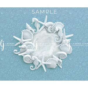 May include: White seashell and starfish wreath with a white background. The wreath is made of seashells, starfish, and seahorses. The background is a light blue with a pattern of seashells and starfish.