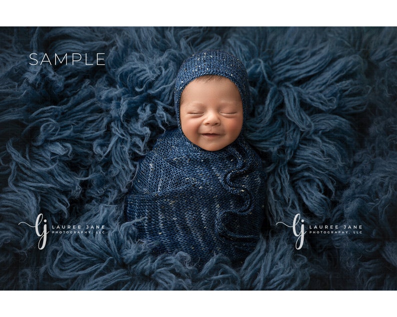 May include: A newborn baby is swaddled in a blue and white patterned blanket and wearing a blue knitted hat. The baby is lying on a blue fluffy surface. The image is labeled "SAMPLE" and "LAUREE JANE PHOTOGRAPHY, LLC".