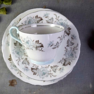 Vintage Aynsley England Bone China Brown Leaves Grey Flowers Silver Rim with Blue Handles and Foot Design Trio: Teacup, Saucer, Side Plate