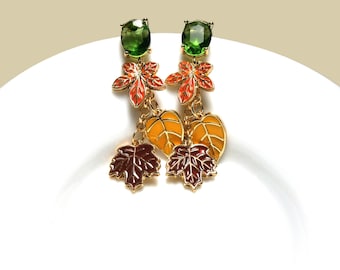 Green crystal earrings with enameled maple leaves in orange, yellow and brown, gold-plated drop earrings