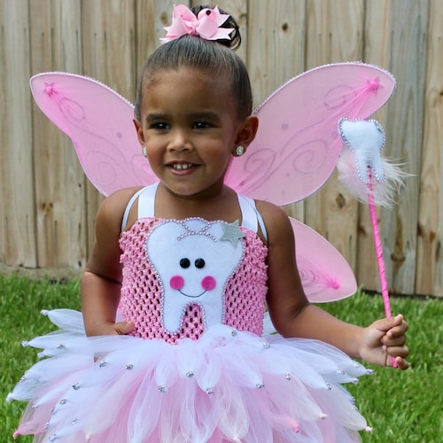 the rock tooth fairy pink dress Happy Birthday to The Rock Also known as the Tooth Fairy !