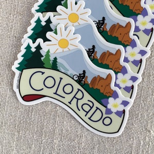 Several illustrated Colorado vinyl stickers on a neutral background.