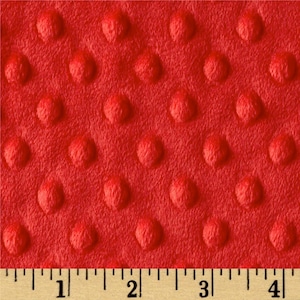 May include: Red textured fabric with a raised dot pattern. The fabric is measured with a ruler showing 4 inches.