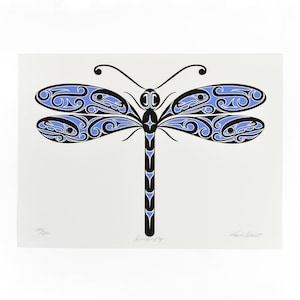 May include: A dragonfly art print with a white background. The dragonfly is black and light blue with intricate patterns on its wings. The word "Dragonfly" is printed in black below the image. The print is numbered 149/200.