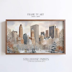 May include: A framed watercolor print of a cityscape in winter. The artwork features tall buildings, bare trees, and a snowy landscape. The frame is made of wood. Text on the print reads "FRAME TV ART" and "STILLHOUSE PRINTS VINTAGE & MODERN ART."
