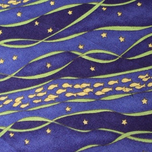 May include: A fabric pattern featuring a night sky theme. The design includes wavy blue and navy stripes, green ribbons, yellow stars, and schools of yellow fish. The overall aesthetic is reminiscent of an underwater scene at night.