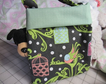 toddler purse with birds and bird cages on black cotton