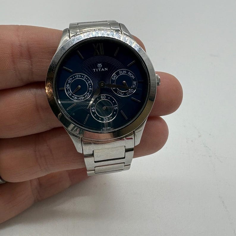 Titan Mens Silver Tone Blue Dial Multifunction Watch 50M WR Needs Battery image 1