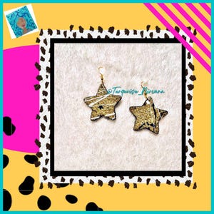 S-48: Pendientes de estrellas con purpurina dorada