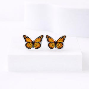 May include: A rustic wooden sign with the text "Welcome to our home" in white lettering. The sign features a distressed finish and a simple, inviting design, perfect for a front porch or entryway.